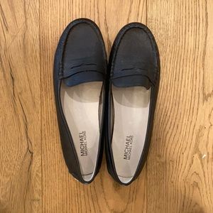 Michael Kors, flat black shoe.